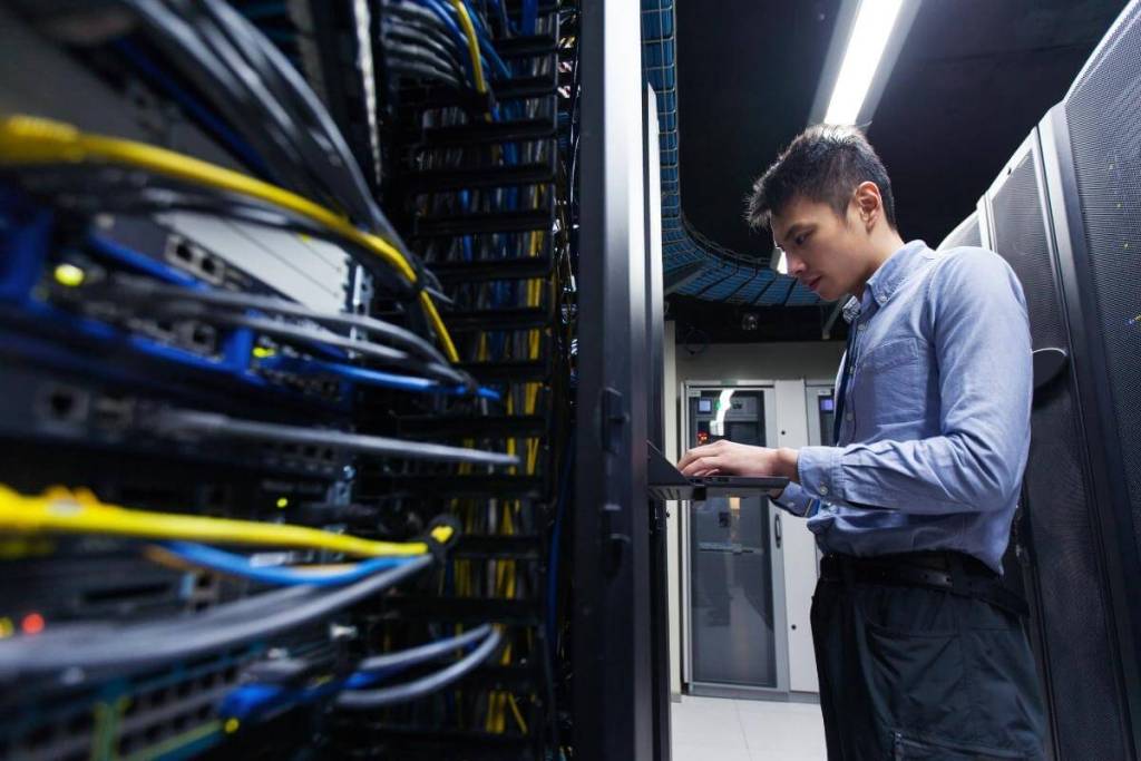 How To Set up a Multi-line Phone SystemYoung IT engineer inspecting data center servers